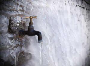 Faucet with icicle hanging out of it